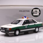 Audi 100 C3 – 1989 – Polizei, alpine white/green Triple9 1:18